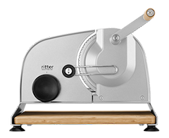 A picture of the manual universal cutter with wooden board.