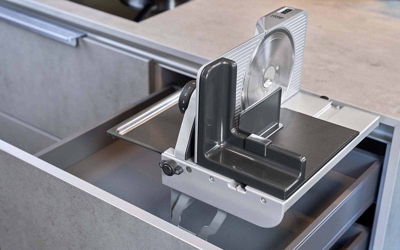 Built-in all-purpose slicer in modern kitchen drawer