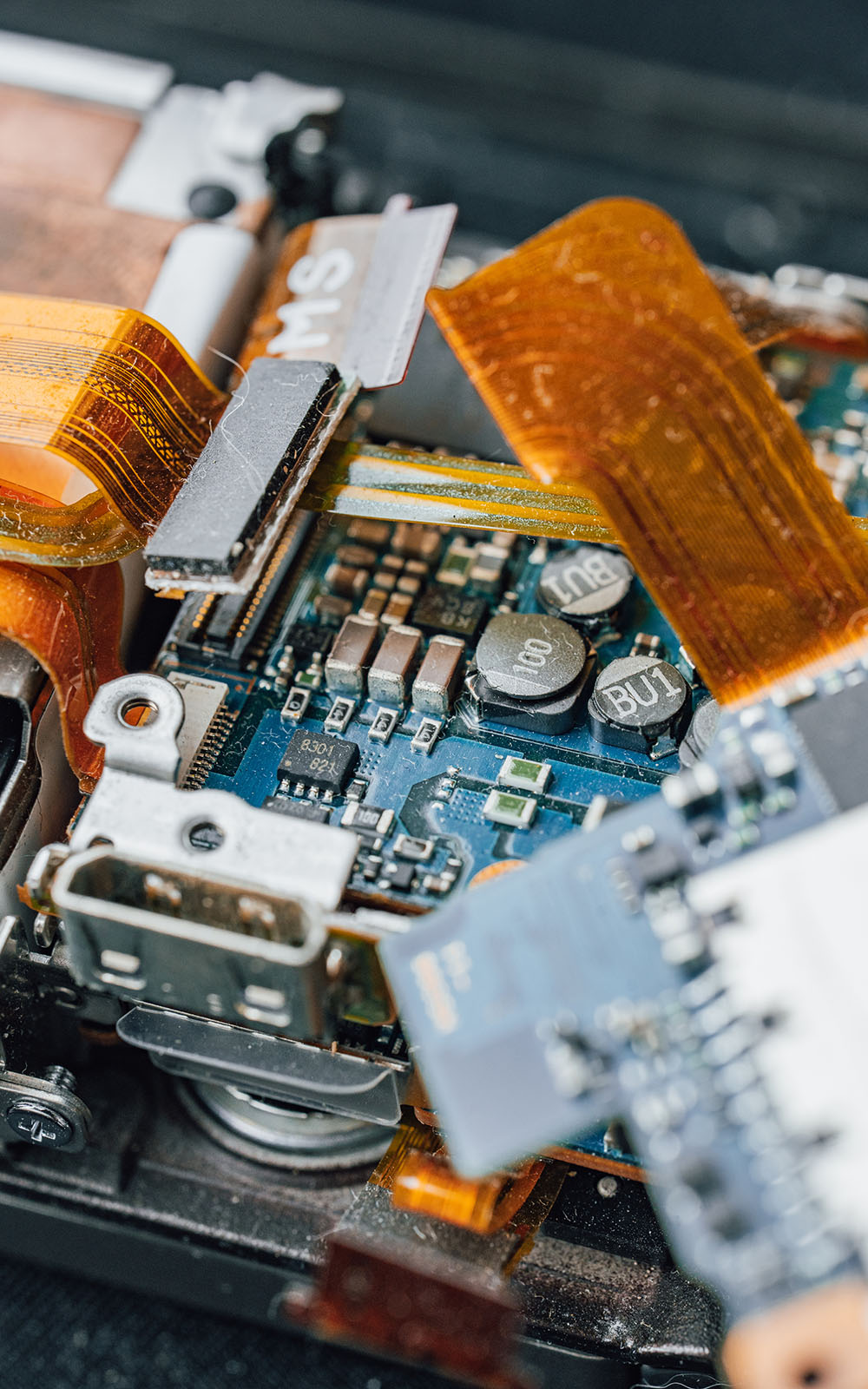 Electronic components and circuit boards on a technical work surface.
