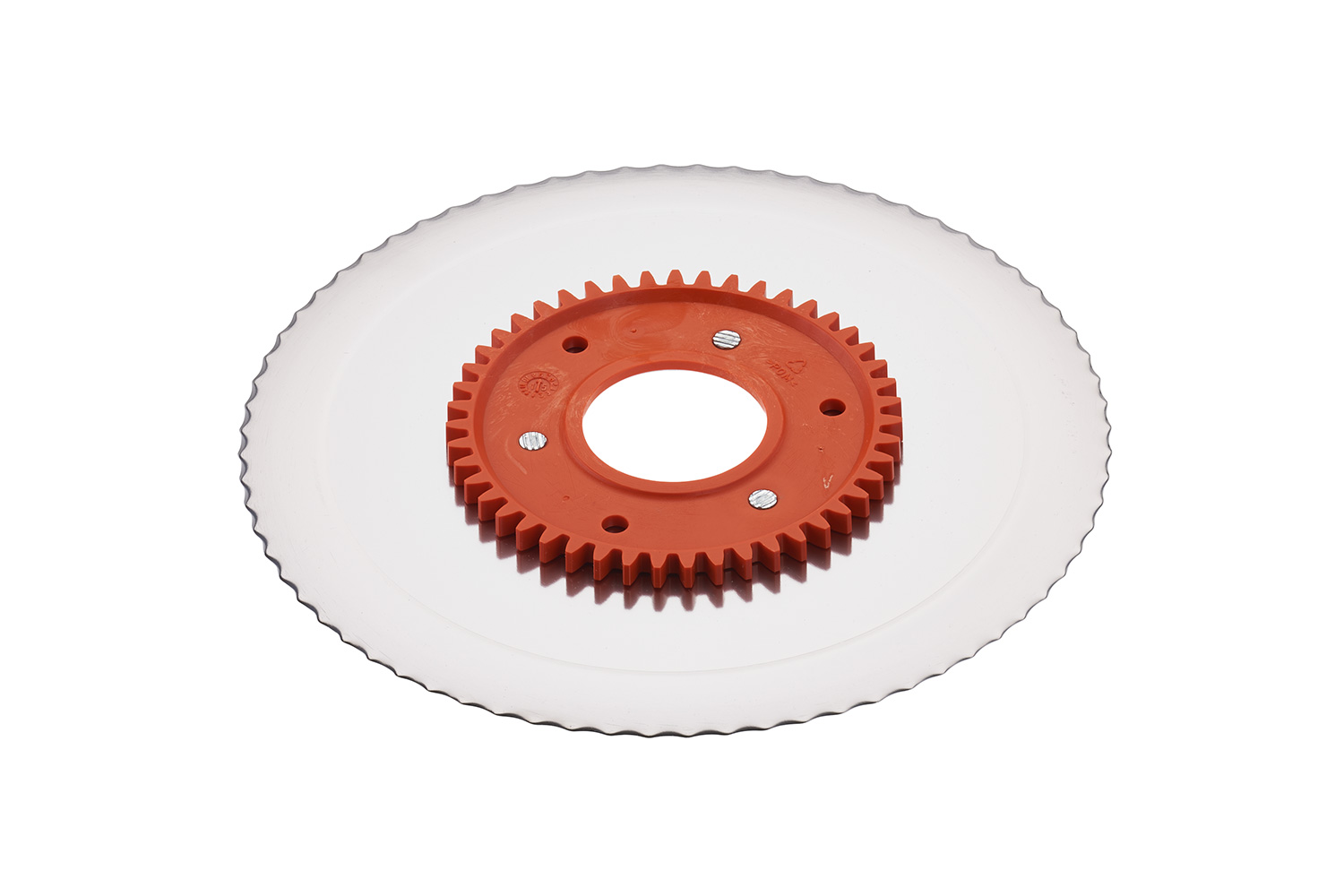 Serrated circular blade with electropolished surface and an orange gear Serrated circular blade with electropolished surface and an orange gear
