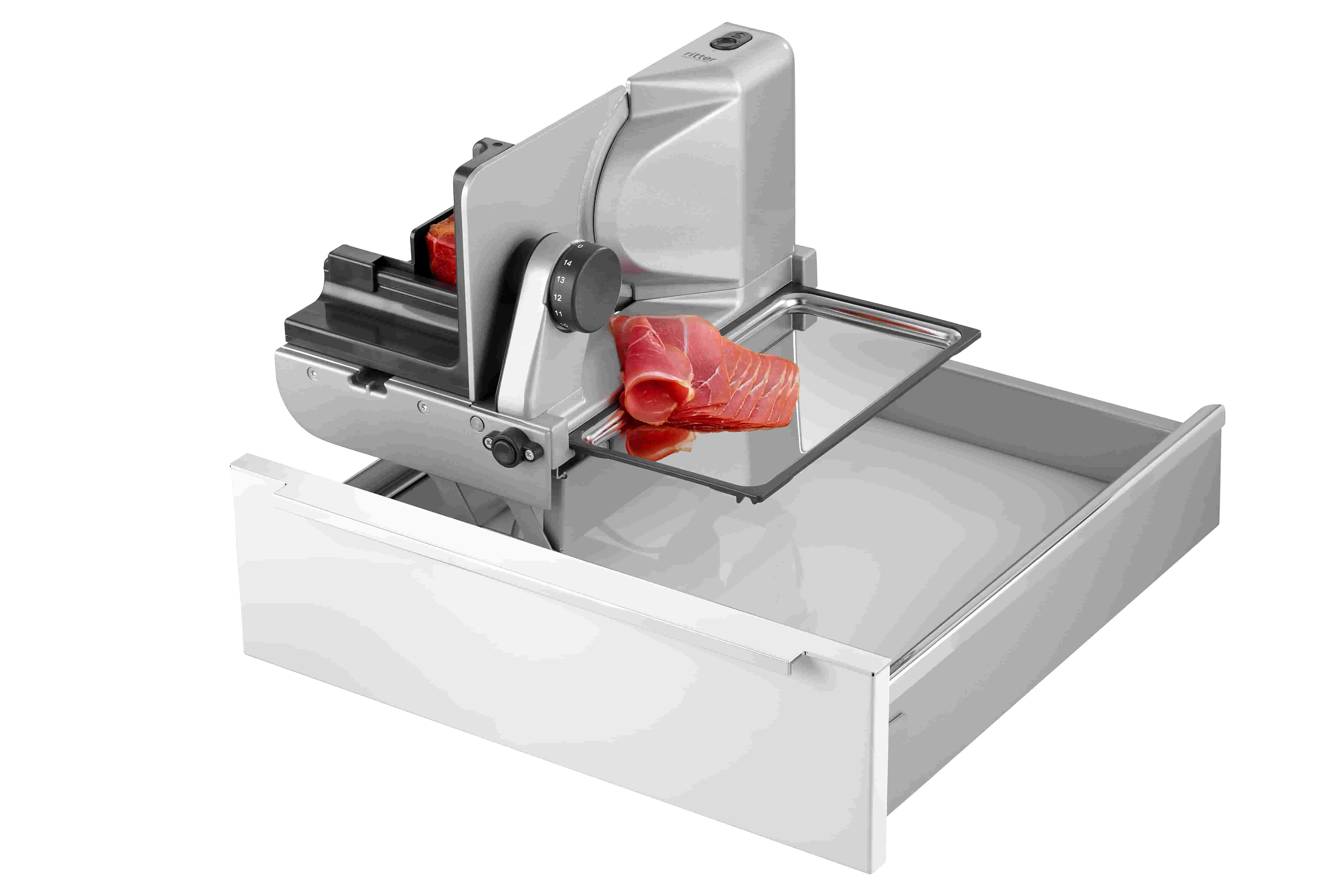 Electric built-in all food slicer in silver, angled view with food to be sliced