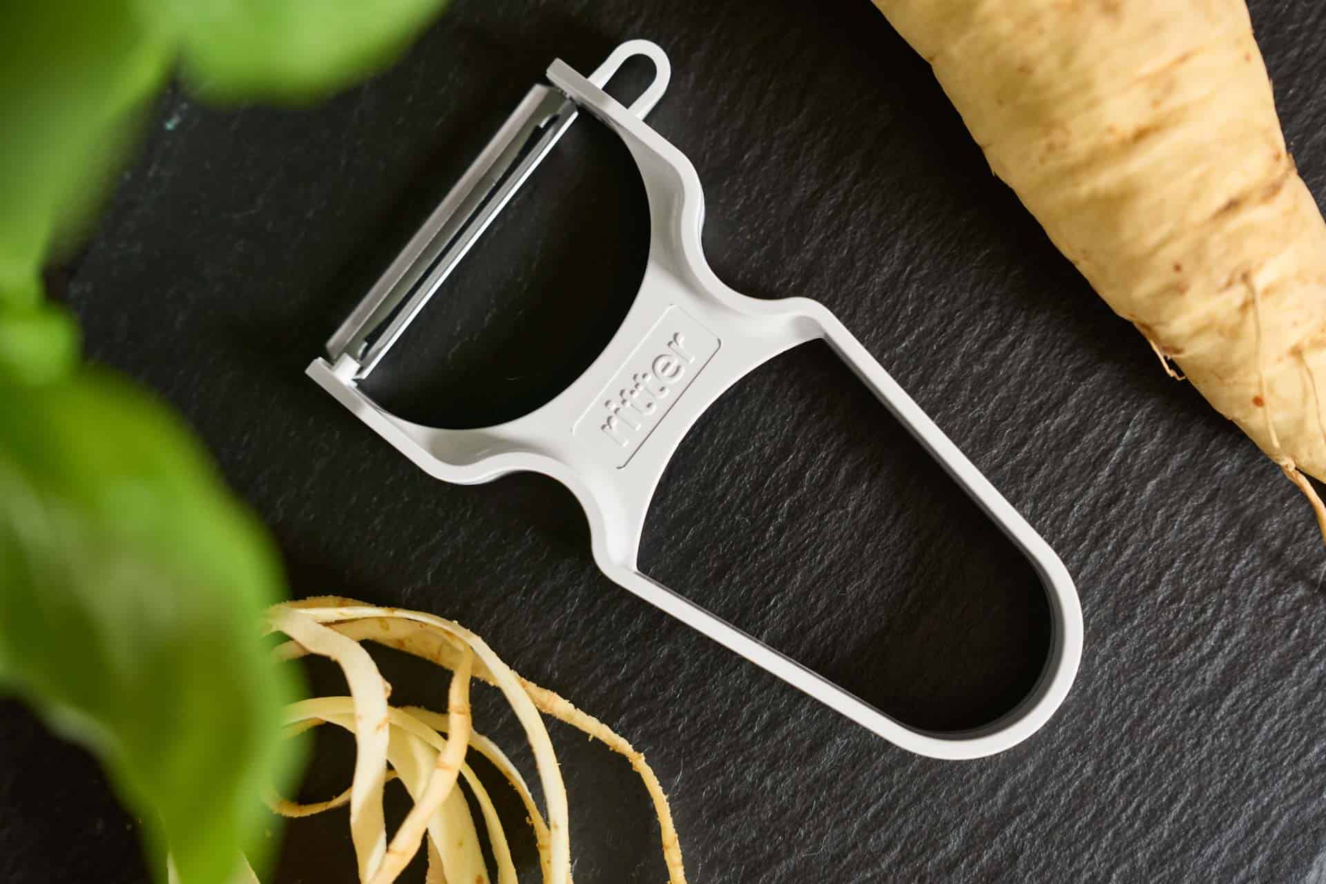 White peeler from ritter with celery on a black base