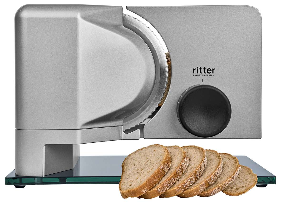 Elektrischer Allesschneider in silber, mit Schneidgut