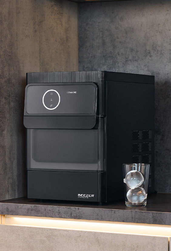 side view of a black ice ball machine