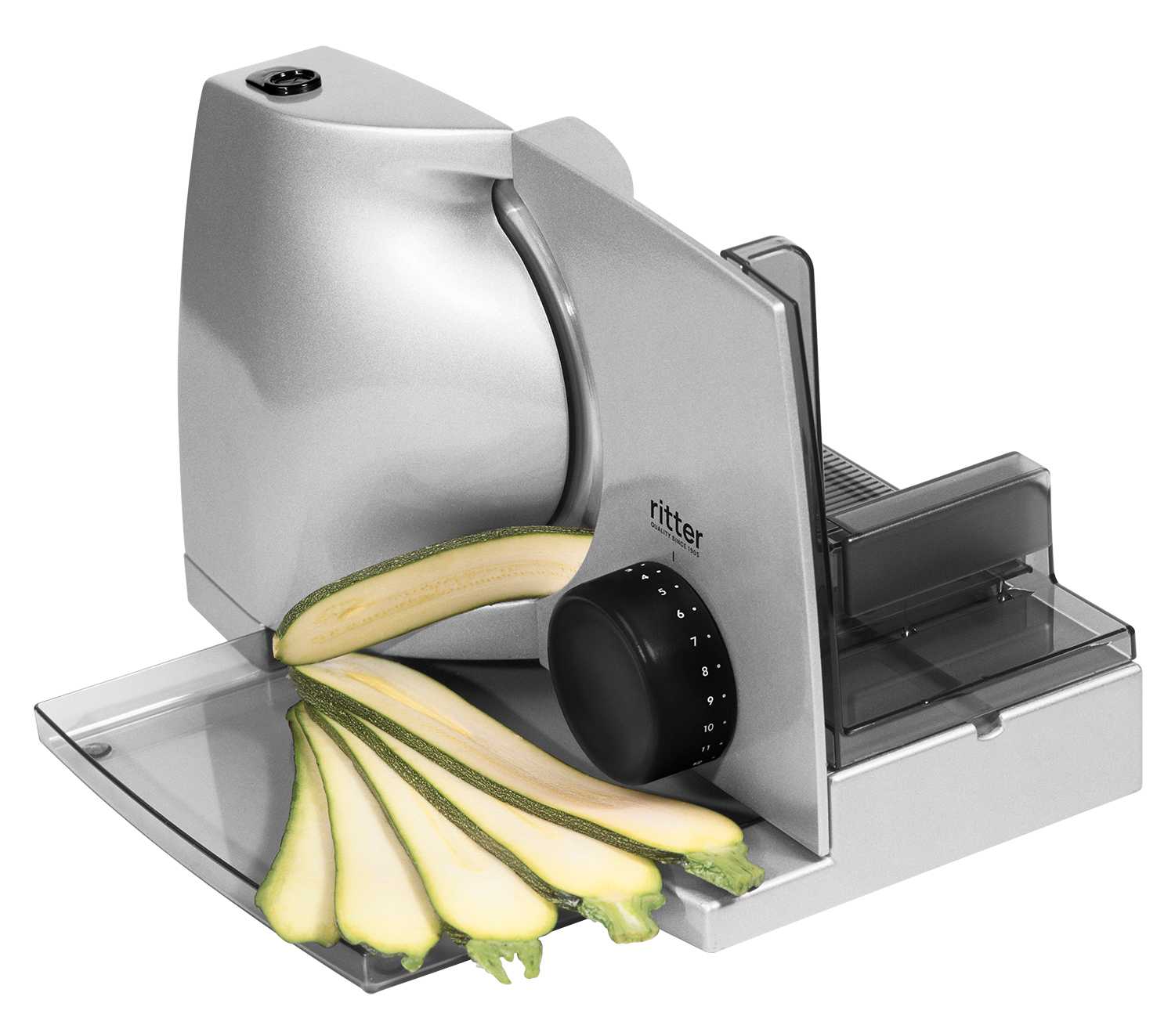 Electric food slicer in silver, angled view with sliced food