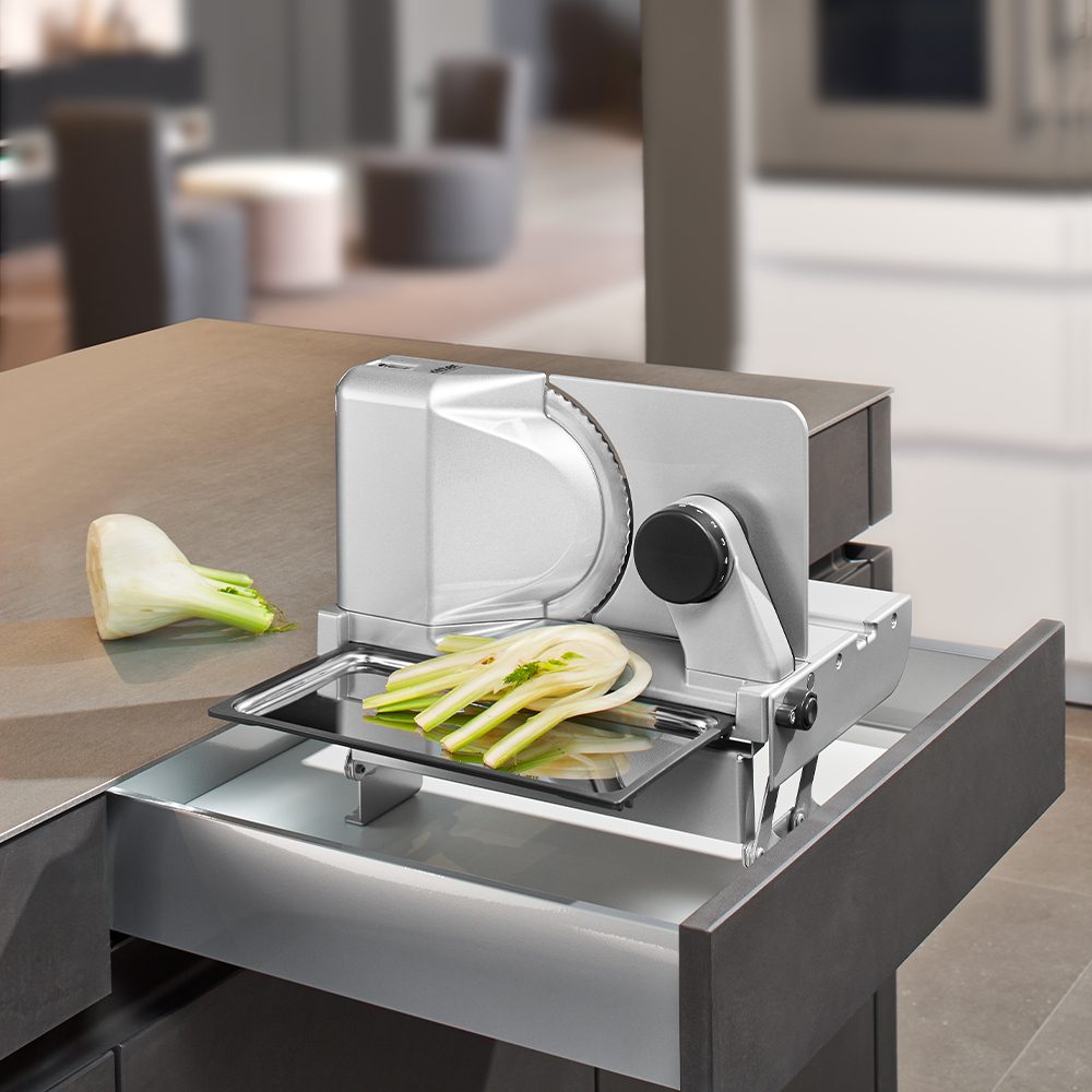 Electric built-in all food slicer in modern kitchen Electric built-in all food slicer in modern kitchen