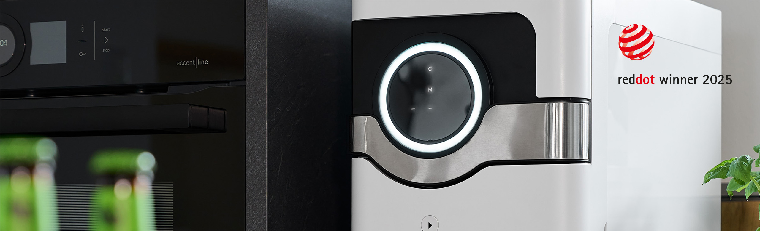 A picture of a white BEEZER beverage cooler, switched on in a kitchen, and a reddot winner 2025 award.