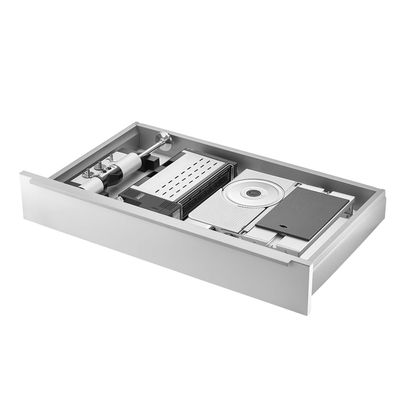Ein Bild einer Schublade, mit einer Einbau-Kombination aus einem Einbau-Stabmixer, einem Einbau-Toaster und einem Einbau-Allesschneider, mit weißem Hintergrund.