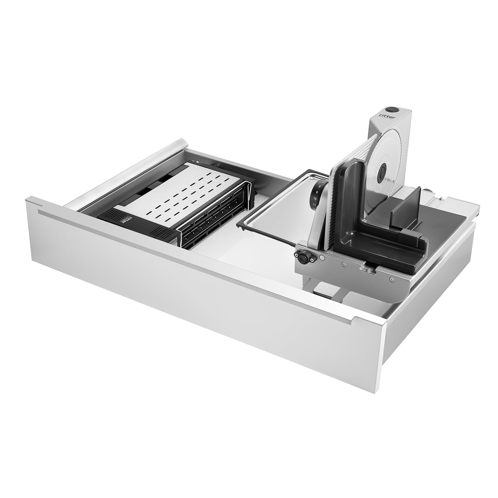 Ein Bild einer Schublade, mit einer Einbau-Kombination aus einem Einbau-Toaster und einem rechtsgeführten und aufgestellten Einbau-Allesschneider, mit weißem Hintergrund.