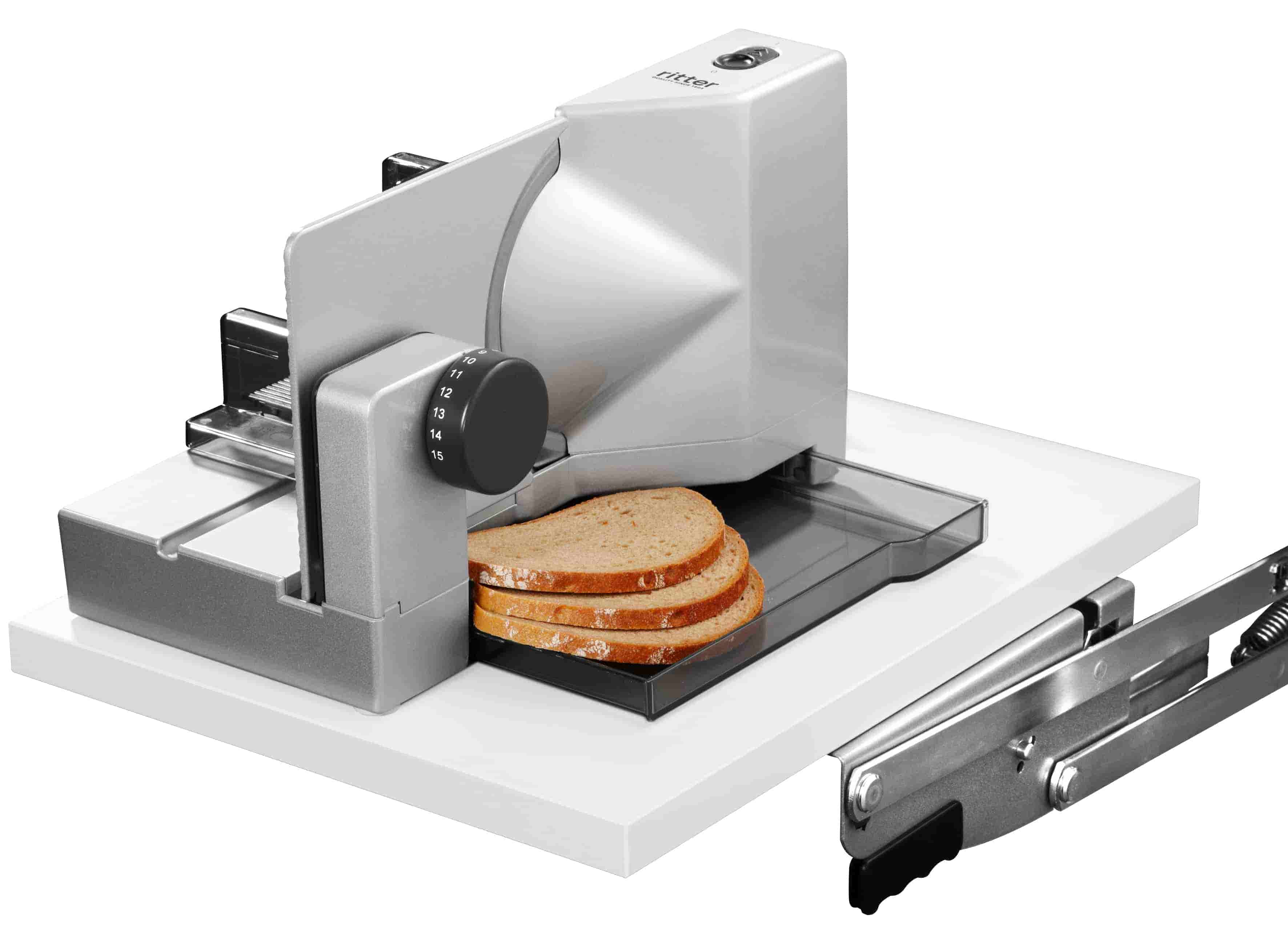 Swing-out built-in food slicer with sliced bread