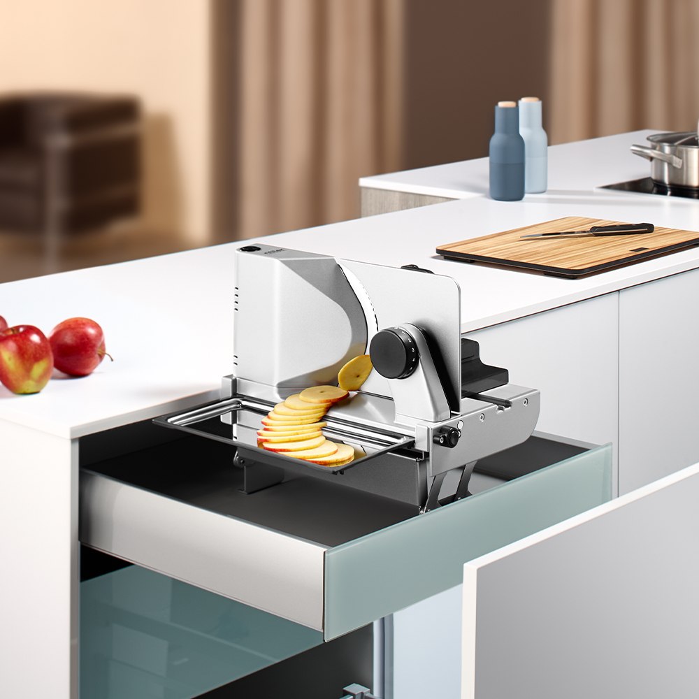 Electric built-in all food slicer in modern kitchen Electric built-in all food slicer in modern kitchen